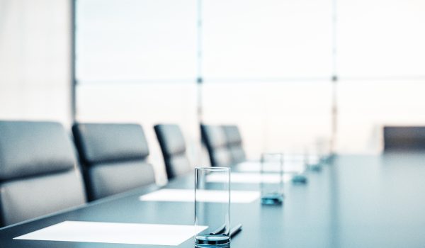 Close up of conference room with glasses of water on the table with papers, armchairs and a large window. 3D Rendering Close up of conference room with glasses of water on the table with papers, armchairs and a large window. 3D Rendering